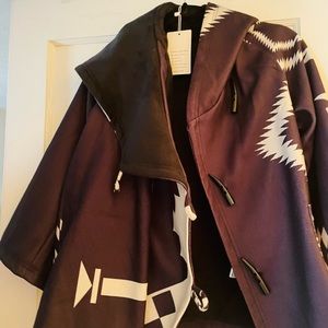 Cropped swing jacket with black and white Geometric print.